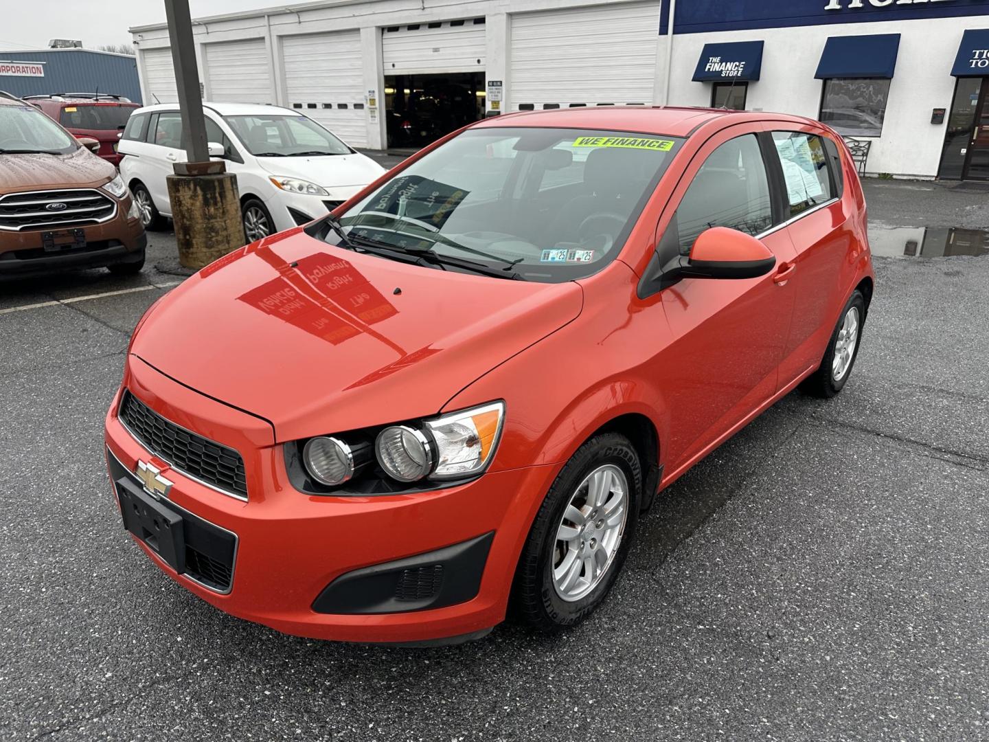 2013 ORANGE Chevrolet Sonic LT Auto 5-Door (1G1JC6SB3D4) with an 1.4L L4 DOHC 24V TURBO FFV engine, 6-Speed Automatic transmission, located at 1254 Manheim Pike, Lancaster, PA, 17601, (717) 393-9133, 40.062870, -76.323273 - Photo#0