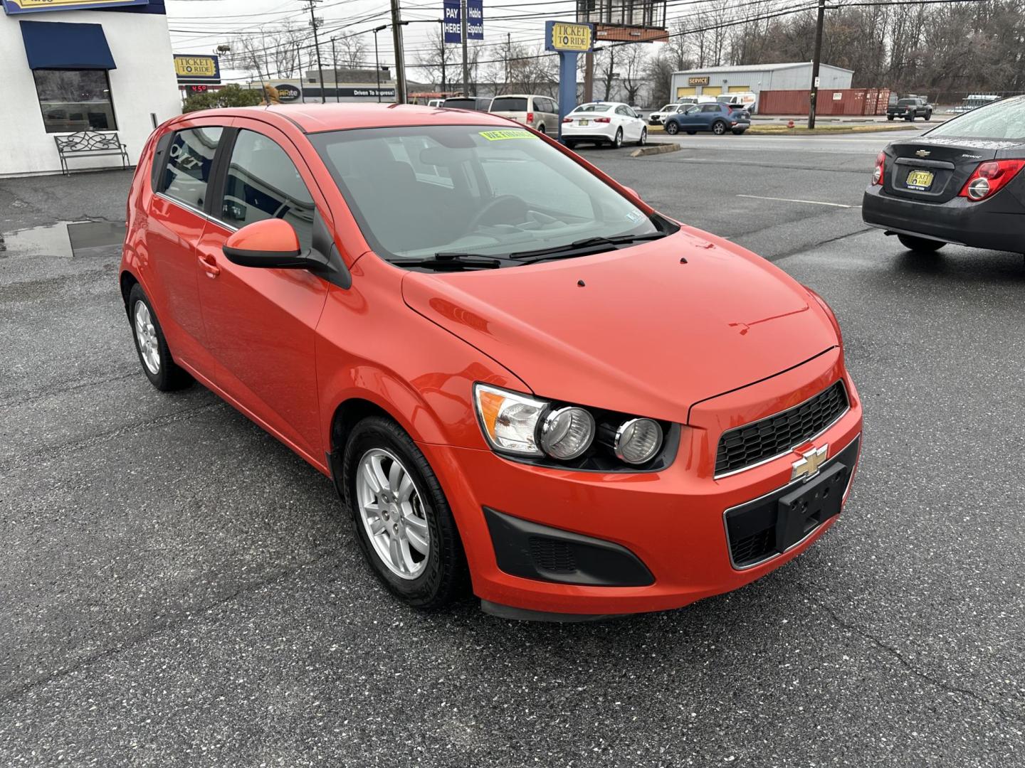 2013 ORANGE Chevrolet Sonic LT Auto 5-Door (1G1JC6SB3D4) with an 1.4L L4 DOHC 24V TURBO FFV engine, 6-Speed Automatic transmission, located at 1254 Manheim Pike, Lancaster, PA, 17601, (717) 393-9133, 40.062870, -76.323273 - Photo#2