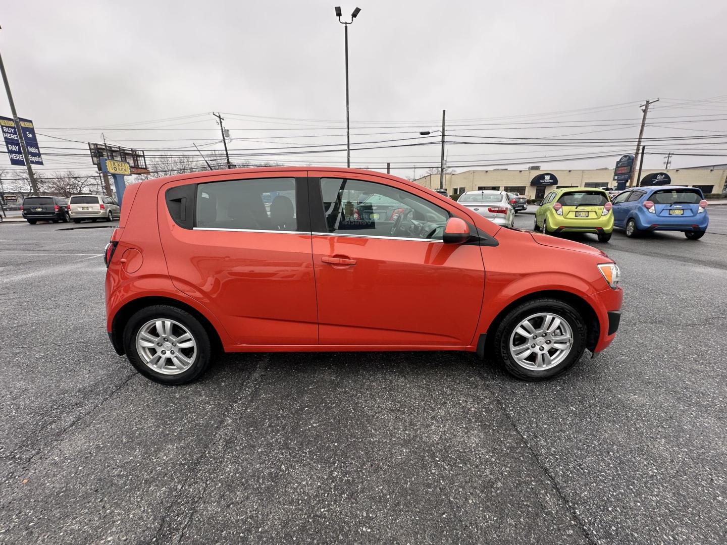 2013 ORANGE Chevrolet Sonic LT Auto 5-Door (1G1JC6SB3D4) with an 1.4L L4 DOHC 24V TURBO FFV engine, 6-Speed Automatic transmission, located at 1254 Manheim Pike, Lancaster, PA, 17601, (717) 393-9133, 40.062870, -76.323273 - Photo#3