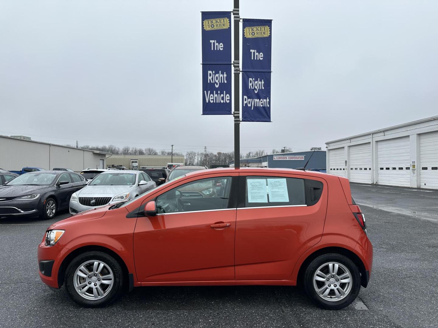 2013 ORANGE Chevrolet Sonic LT Auto 5-Door (1G1JC6SB3D4) with an 1.4L L4 DOHC 24V TURBO FFV engine, 6-Speed Automatic transmission, located at 1254 Manheim Pike, Lancaster, PA, 17601, (717) 393-9133, 40.062870, -76.323273 - Photo#4