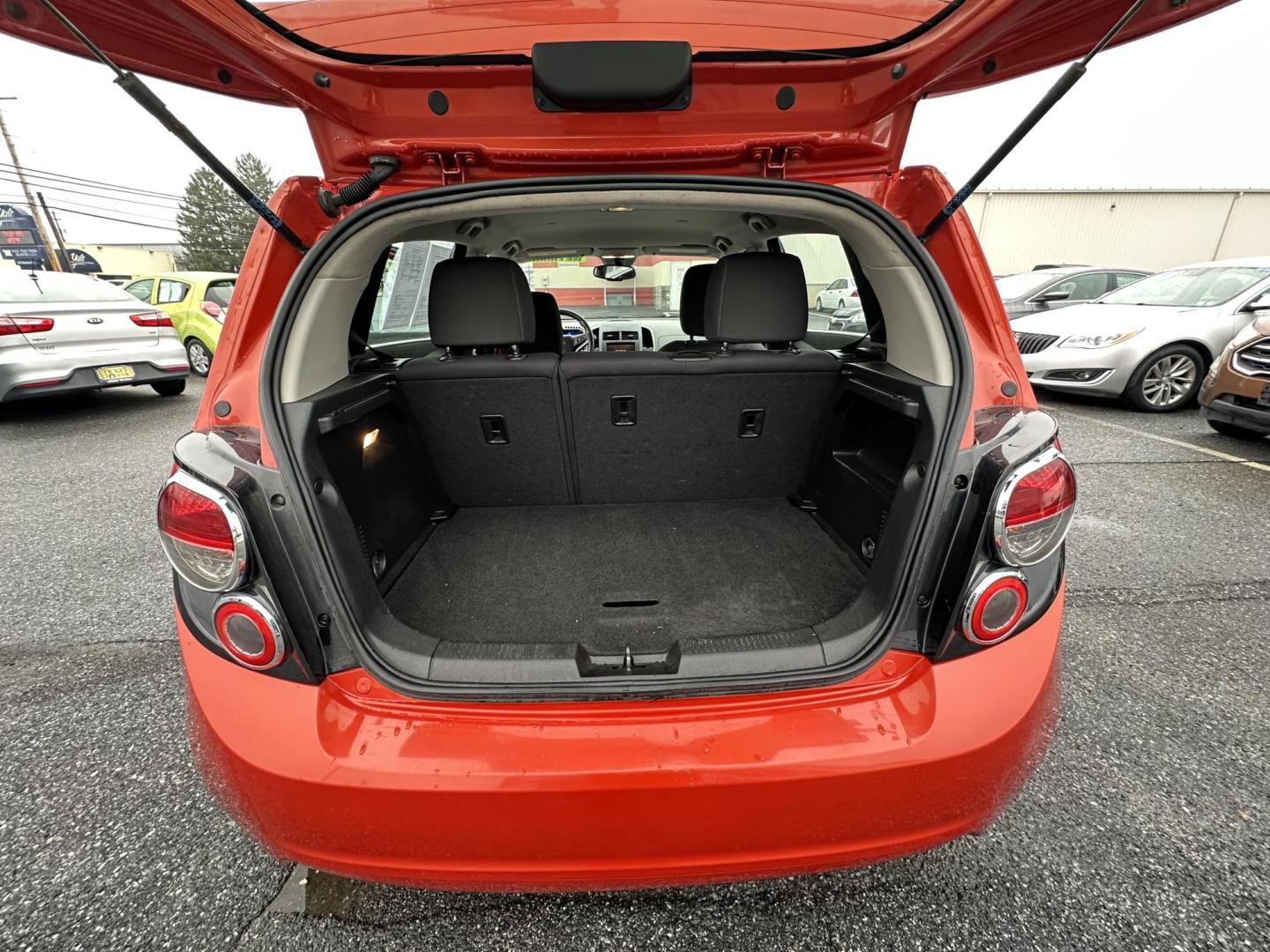 2013 ORANGE Chevrolet Sonic LT Auto 5-Door (1G1JC6SB3D4) with an 1.4L L4 DOHC 24V TURBO FFV engine, 6-Speed Automatic transmission, located at 1254 Manheim Pike, Lancaster, PA, 17601, (717) 393-9133, 40.062870, -76.323273 - Photo#8