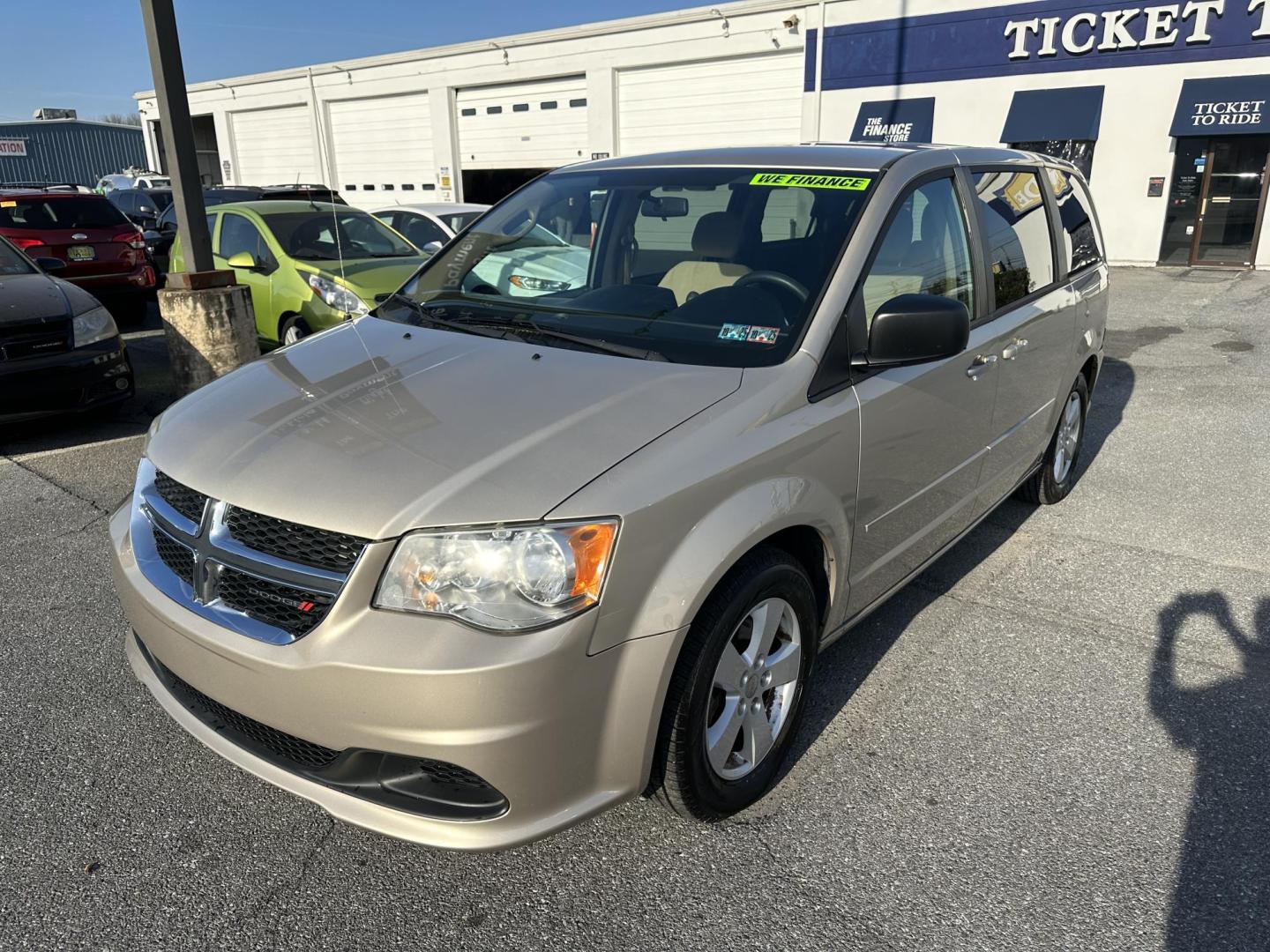 2013 GOLD Dodge Grand Caravan SE (2C4RDGBG2DR) with an 3.6L V6 DOHC 24V engine, 6-Speed Automatic transmission, located at 1254 Manheim Pike, Lancaster, PA, 17601, (717) 393-9133, 40.062870, -76.323273 - Photo#1