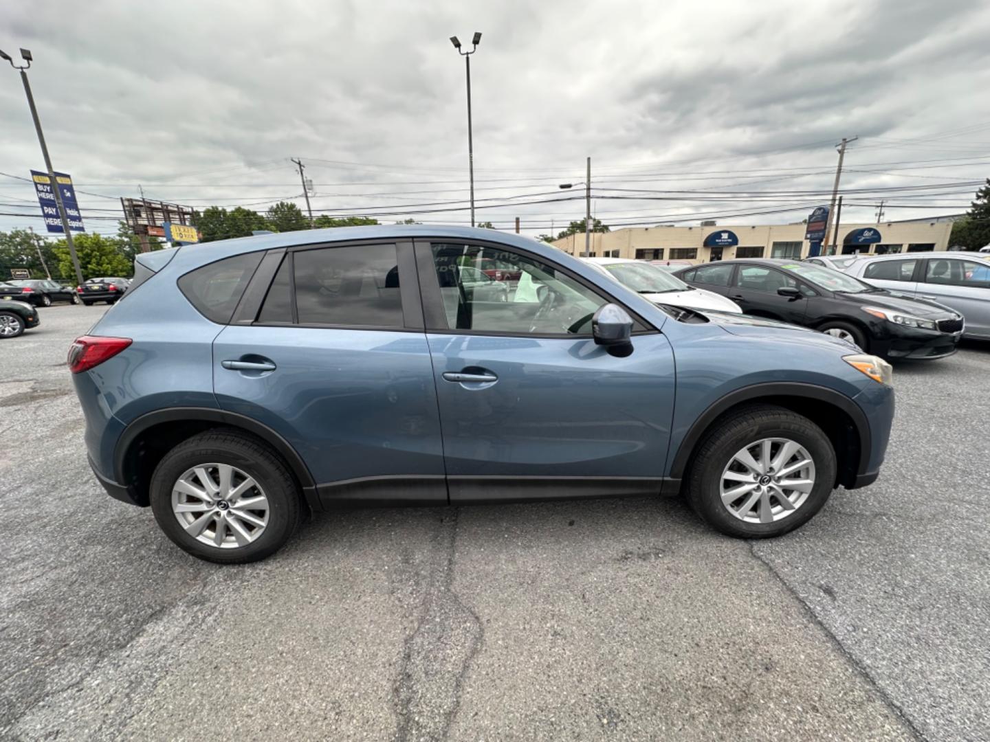 2015 BLUE Mazda CX-5 Touring AWD (JM3KE4CY7F0) with an 2.5L L4 DOHC 16V engine, 6-Speed Automatic transmission, located at 1254 Manheim Pike, Lancaster, PA, 17601, (717) 393-9133, 40.062870, -76.323273 - Photo#3