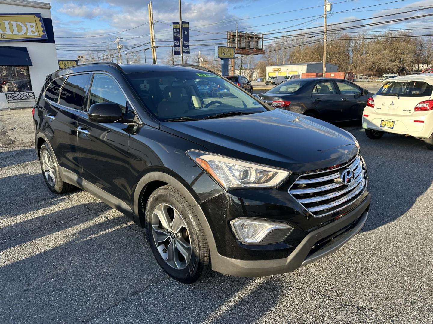 2016 BLACK Hyundai Santa Fe SE AWD (KM8SMDHF5GU) with an 3.3L V6 DOHC 24V engine, 6A transmission, located at 1254 Manheim Pike, Lancaster, PA, 17601, (717) 393-9133, 40.062870, -76.323273 - Photo#0